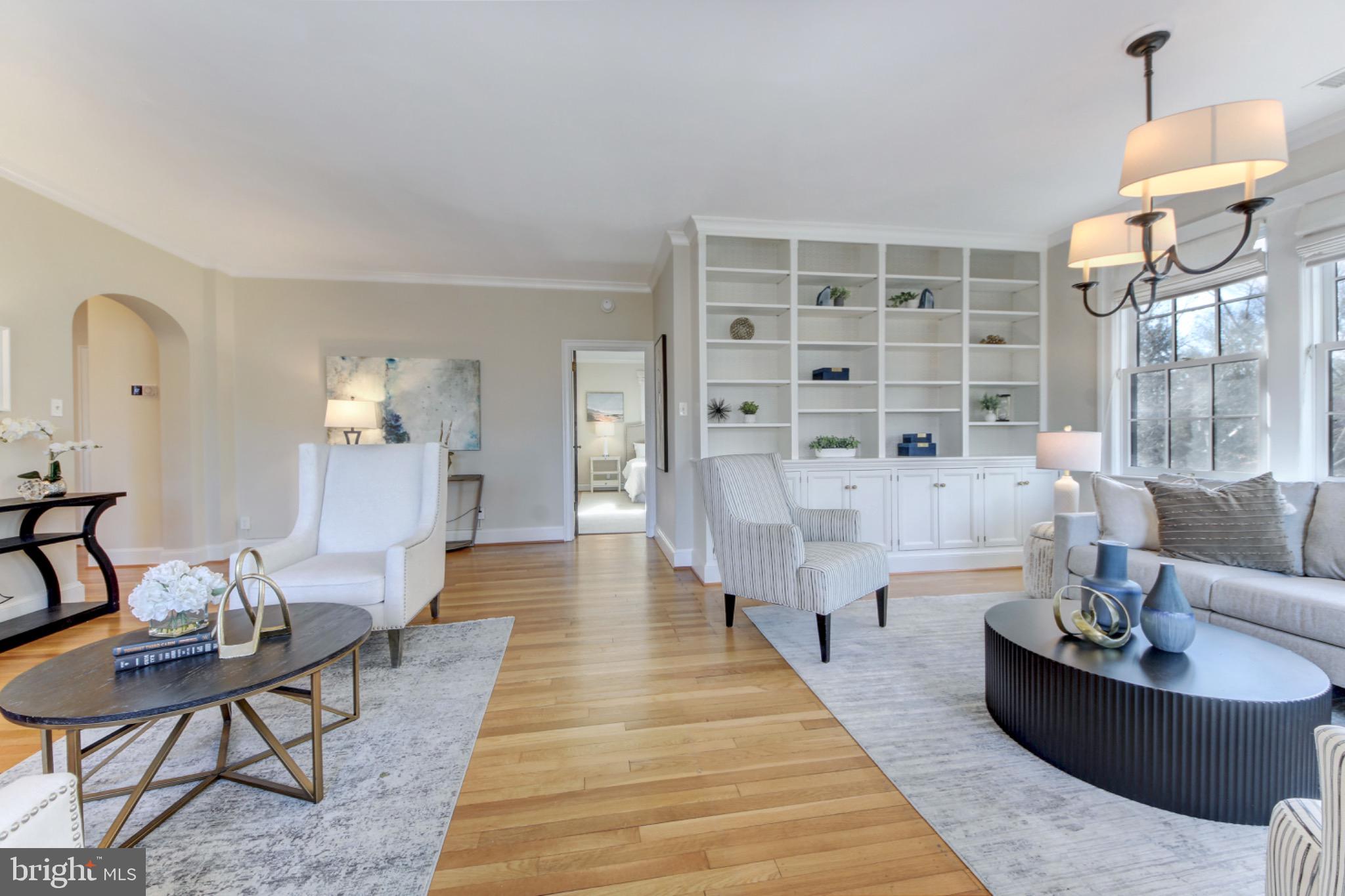 3000 Tilden Street Northwest, Unit 501I Washington, DC 20008 - Photo 2 of 48 a dining room with wooden floor and large windows