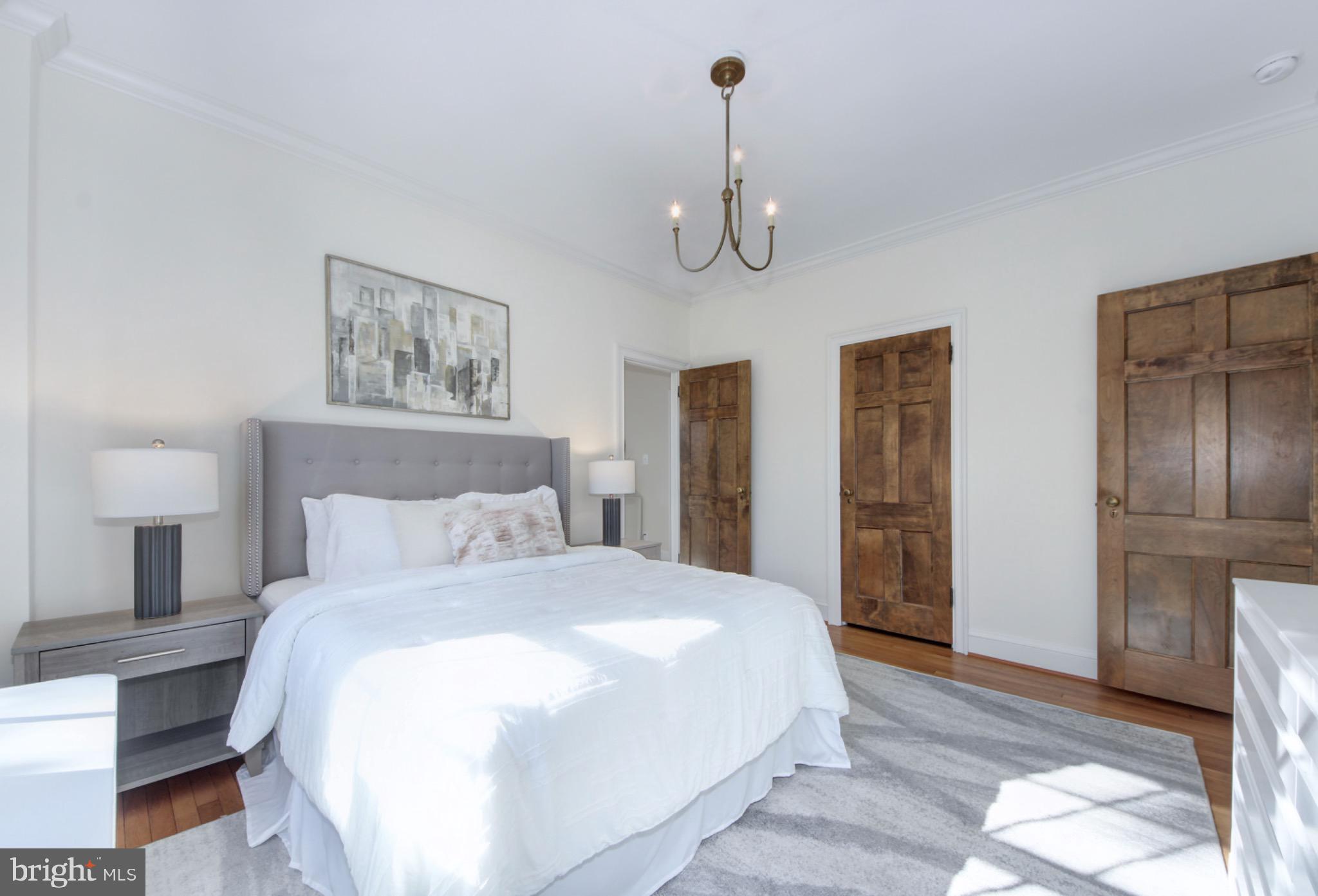 3000 Tilden Street Northwest, Unit 501I Washington, DC 20008 - Photo 25 of 48 a bedroom with a bed and a view of bathroom