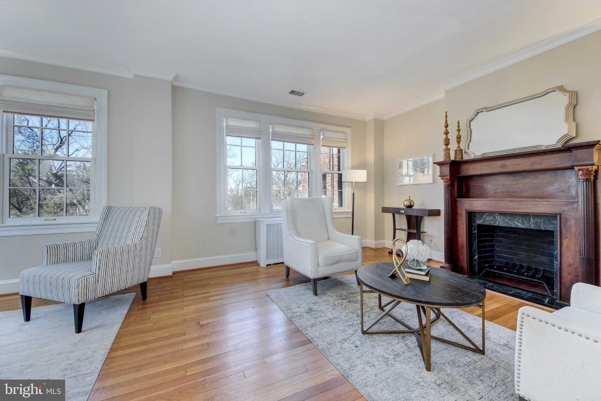 3000 Tilden Street Northwest, Unit 501I Washington, DC 20008 - Photo 5 of 48 a living room with furniture and a fireplace