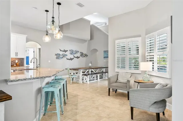 a bedroom with a bed dresser and a window