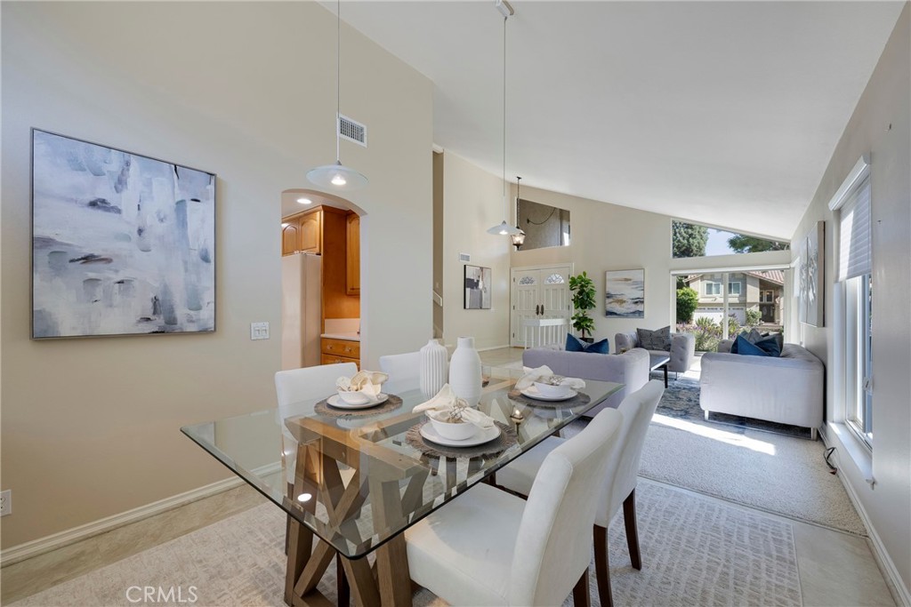 19 Ninos Irvine, CA 92620 - Photo 13 of 65 a view of a dining room with furniture and wooden floor