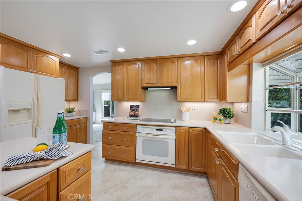 19 Ninos Irvine, CA 92620 - Photo 15 of 65 a kitchen with a sink stove and cabinets