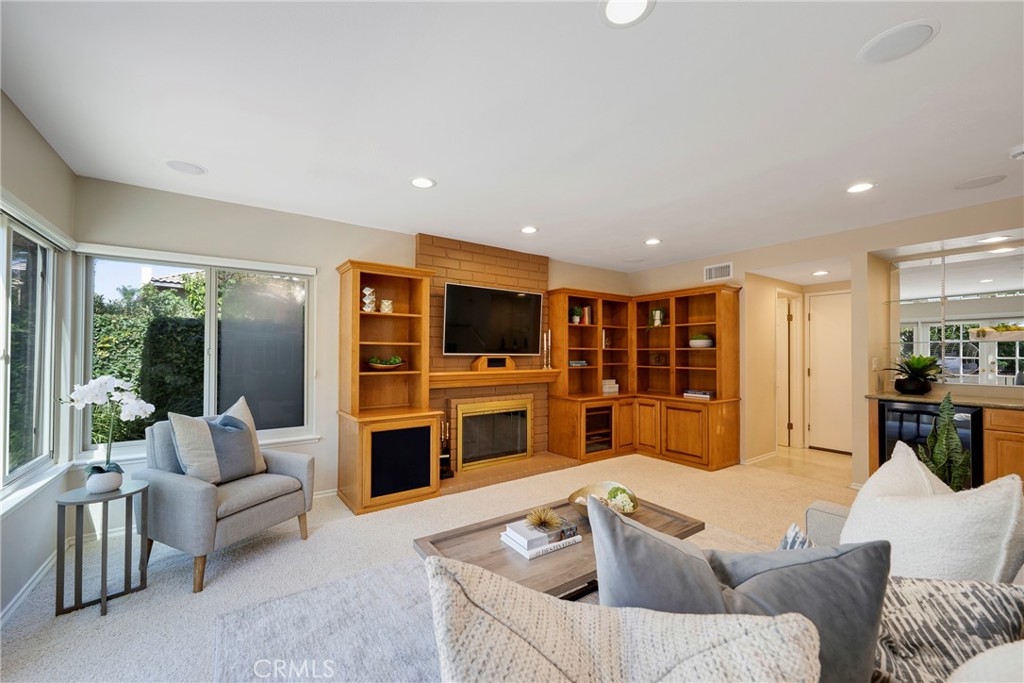 19 Ninos Irvine, CA 92620 - Photo 18 of 65 a living room with furniture and a flat screen tv