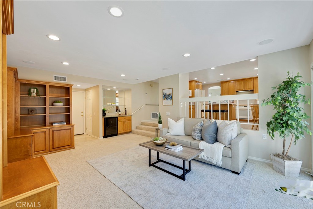 19 Ninos Irvine, CA 92620 - Photo 19 of 65 a living room with furniture and a potted plant