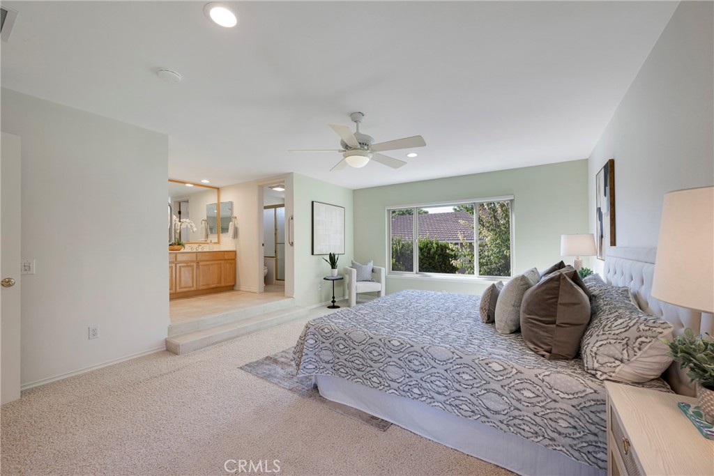 19 Ninos Irvine, CA 92620 - Photo 26 of 65 a bedroom with a large bed and a large window