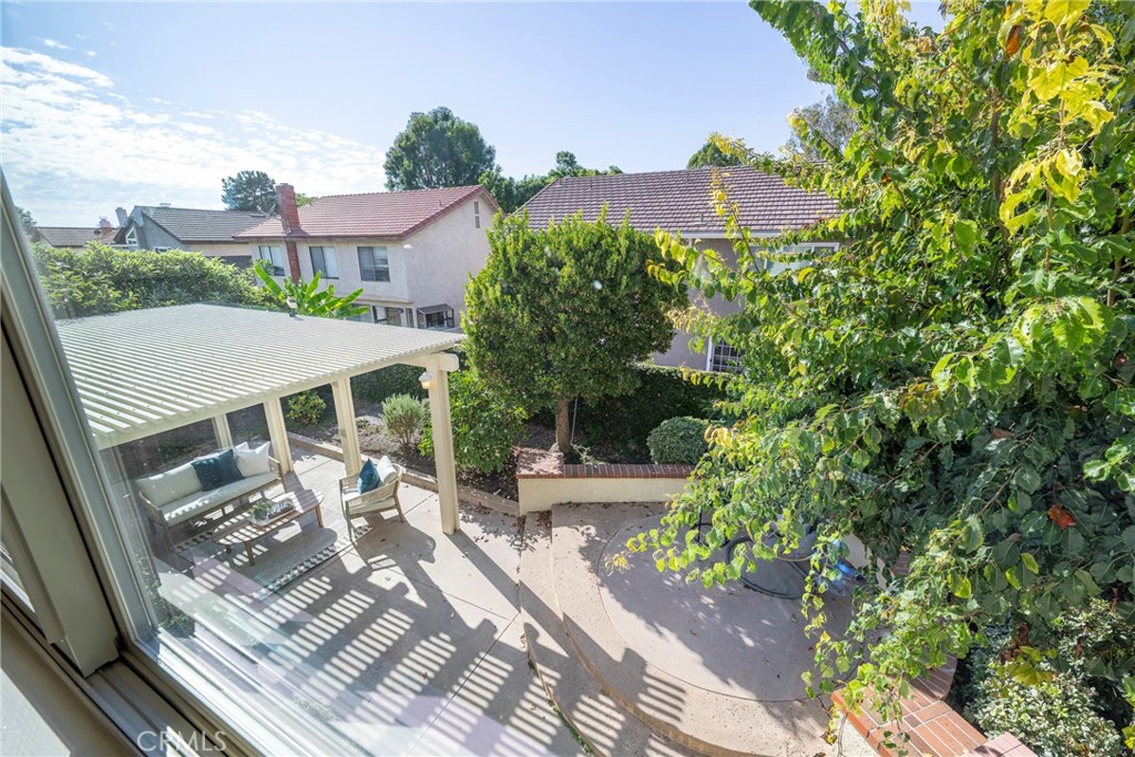 19 Ninos Irvine, CA 92620 - Photo 29 of 65 a view of a patio with a table and chairs