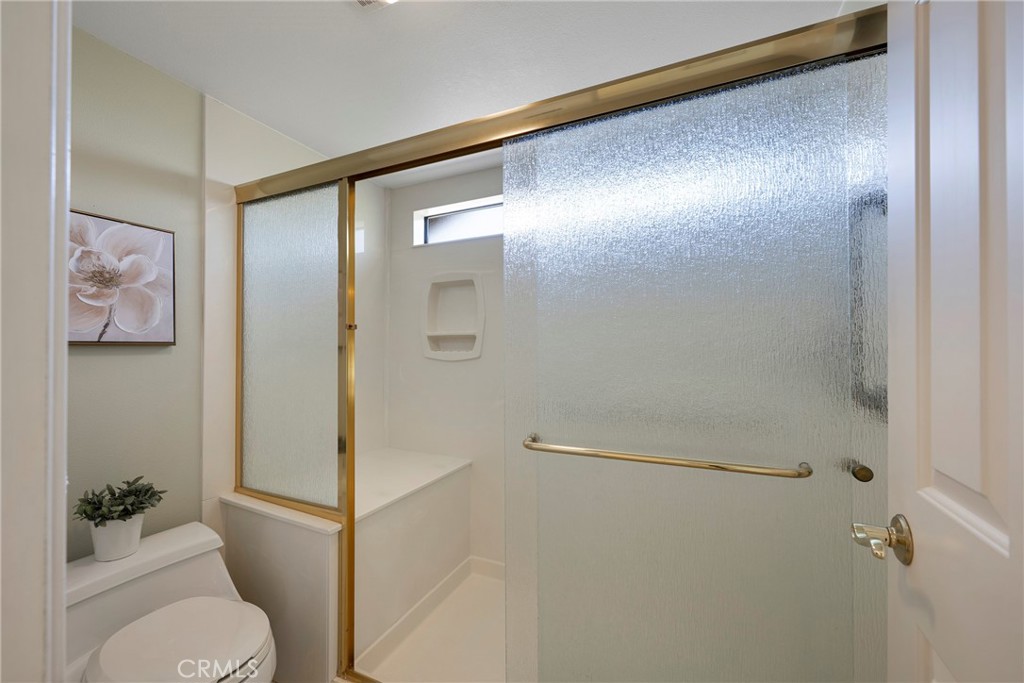 19 Ninos Irvine, CA 92620 - Photo 31 of 65 a bathroom with a glass shower door