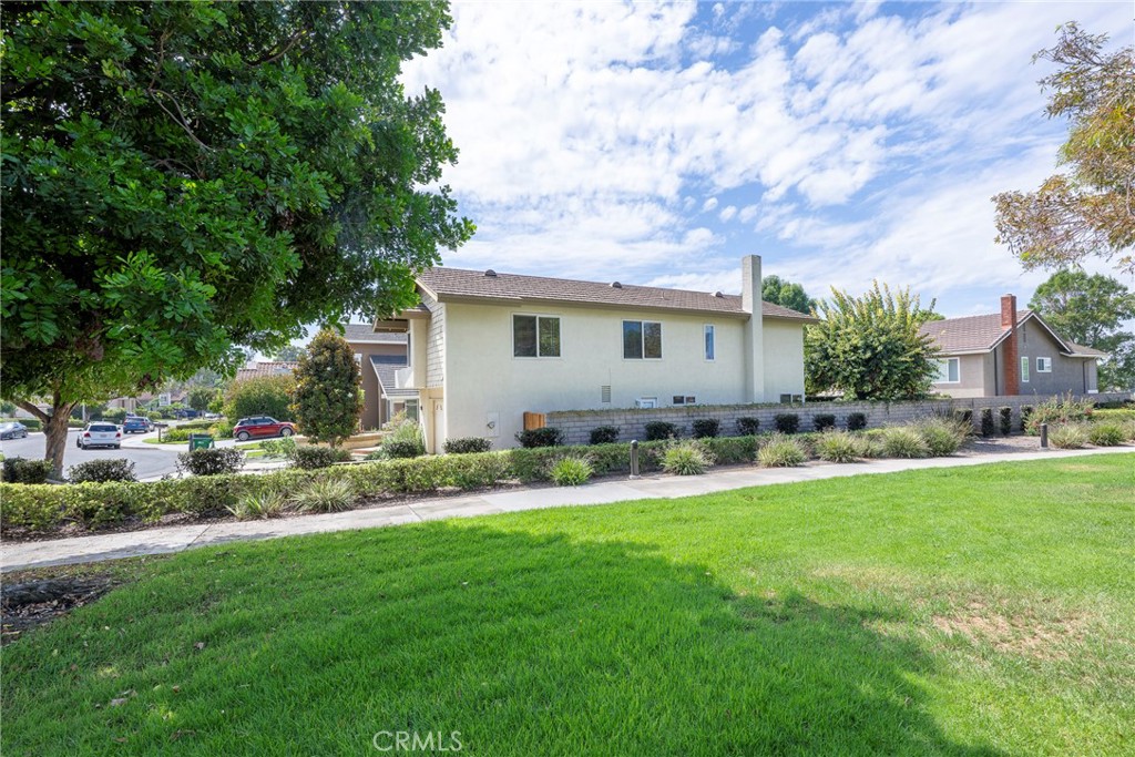 19 Ninos Irvine, CA 92620 - Photo 53 of 65 a view of backyard with table and chairs and potted plants