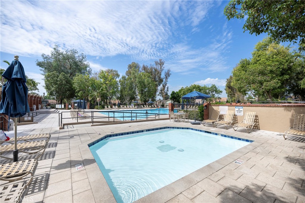 19 Ninos Irvine, CA 92620 - Photo 58 of 65 a view of a swimming pool with a lounge chair