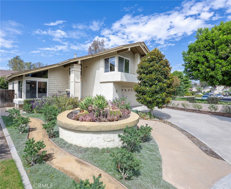 19 Ninos Irvine, CA 92620 - Photo 9 of 65 a front view of house with yard and green space