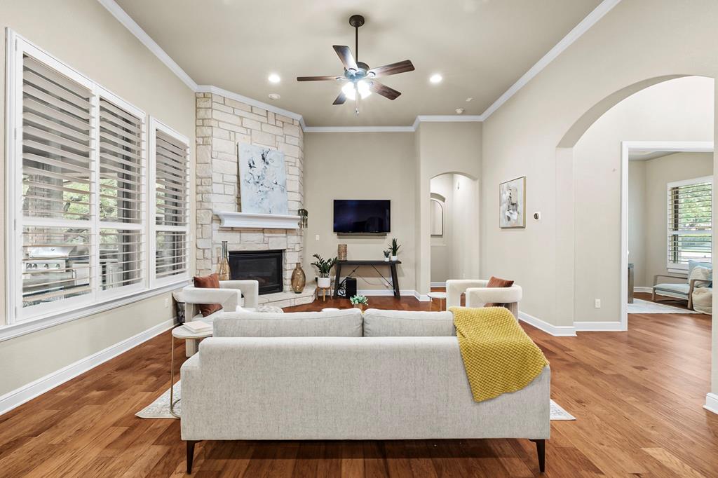 210 Mickelson Lane Georgetown, TX 78628 - Photo 16 of 39 a living room with fireplace furniture and a flat screen tv
