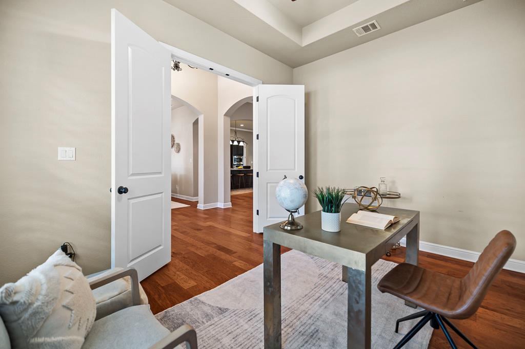 210 Mickelson Lane Georgetown, TX 78628 - Photo 19 of 39 a living room with furniture and wooden floor