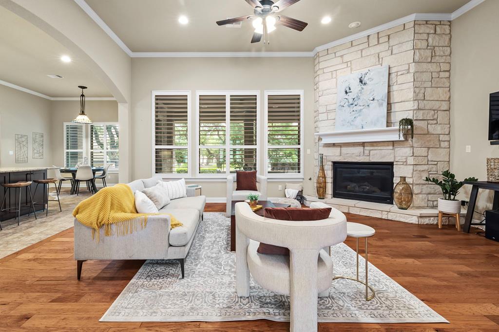 210 Mickelson Lane Georgetown, TX 78628 - Photo 2 of 39 a living room with furniture and a fireplace