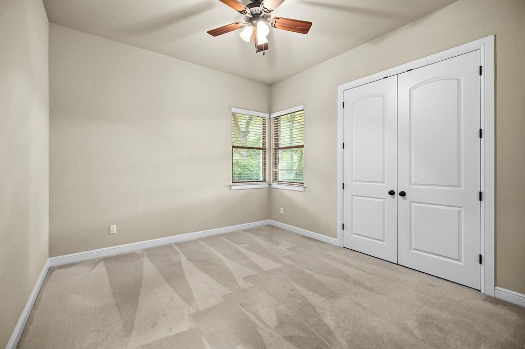 210 Mickelson Lane Georgetown, TX 78628 - Photo 21 of 39 wooden floor in an empty room with a window