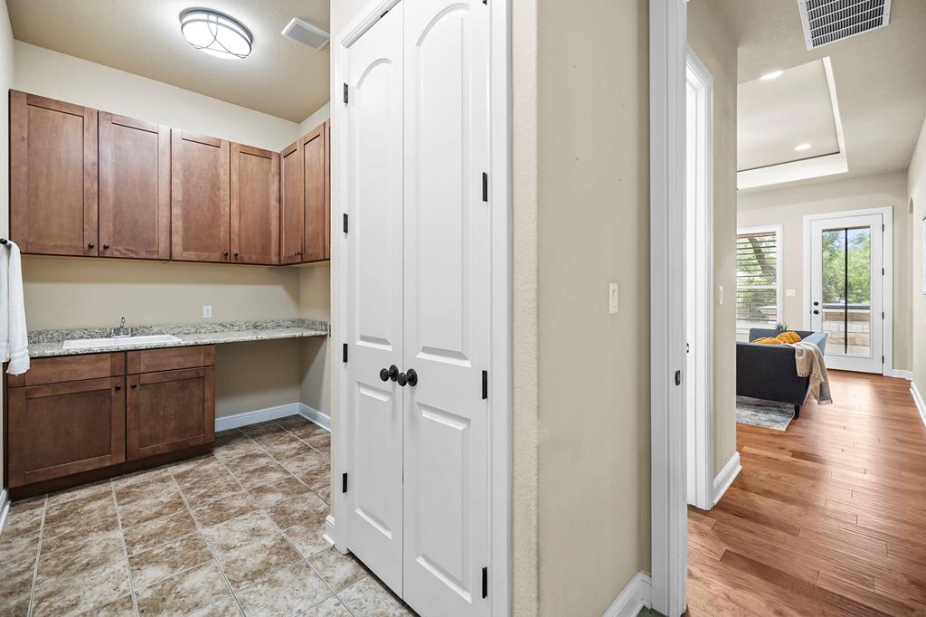 210 Mickelson Lane Georgetown, TX 78628 - Photo 26 of 39 a kitchen with a refrigerator and a sink