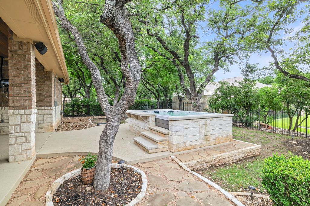 210 Mickelson Lane Georgetown, TX 78628 - Photo 29 of 39 a view of a yard with table and chairs and potted plants