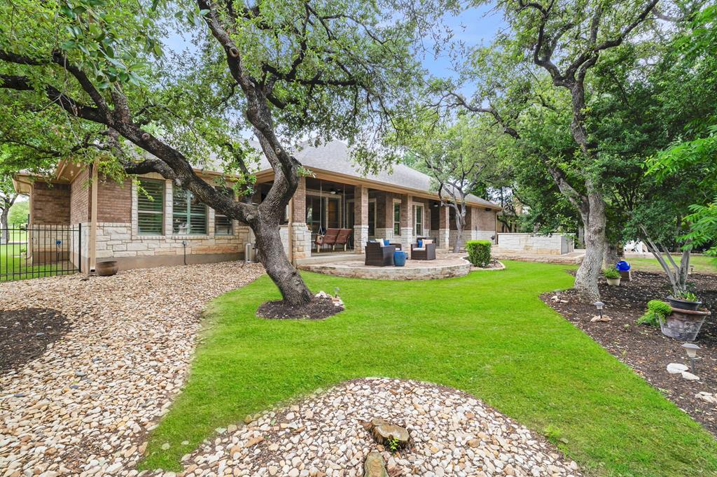 210 Mickelson Lane Georgetown, TX 78628 - Photo 31 of 39 a front view of a house with garden