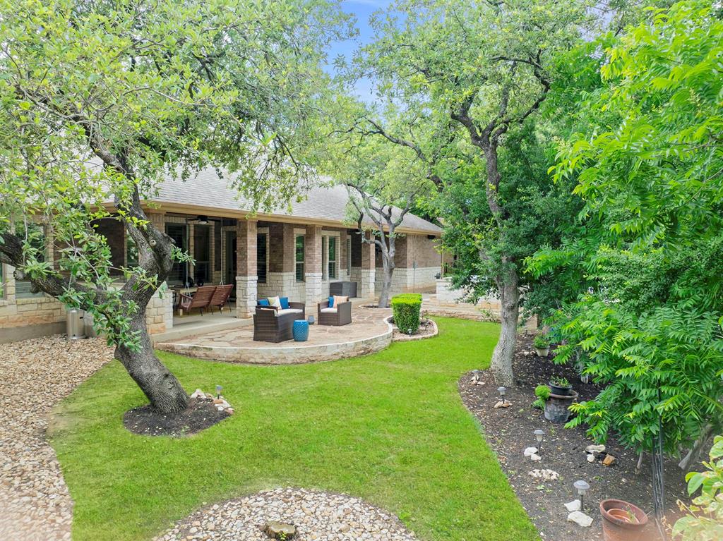 210 Mickelson Lane Georgetown, TX 78628 - Photo 32 of 39 a view of a house with backyard porch and sitting area