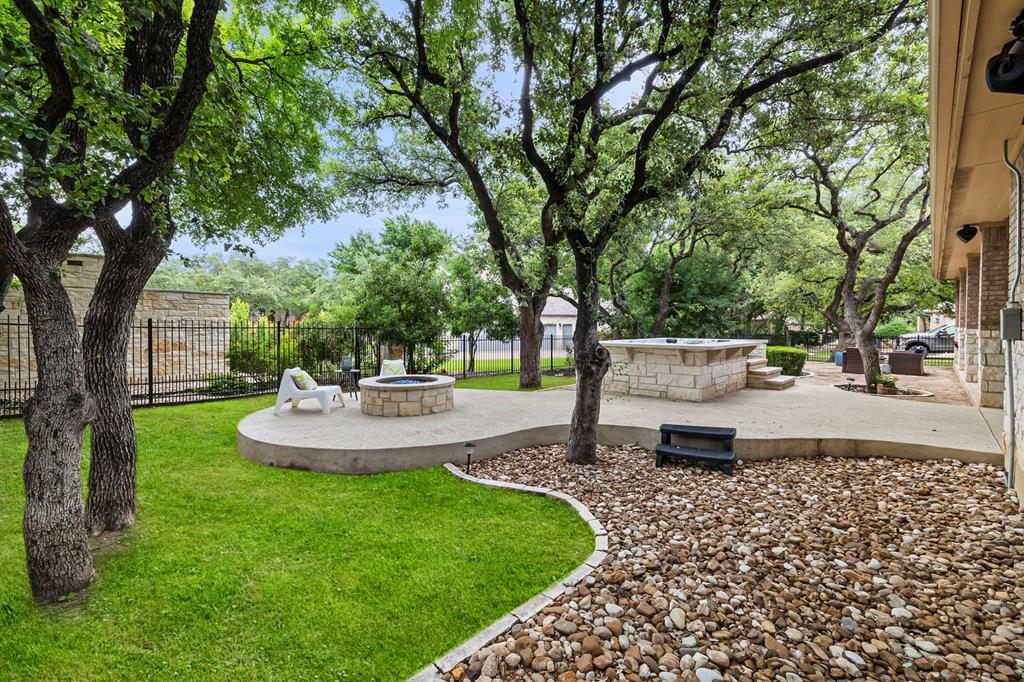 210 Mickelson Lane Georgetown, TX 78628 - Photo 34 of 39 a view of a backyard with sitting area