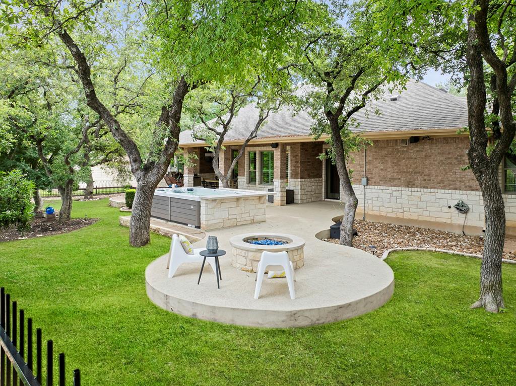 210 Mickelson Lane Georgetown, TX 78628 - Photo 35 of 39 a view of a house with backyard porch and sitting area