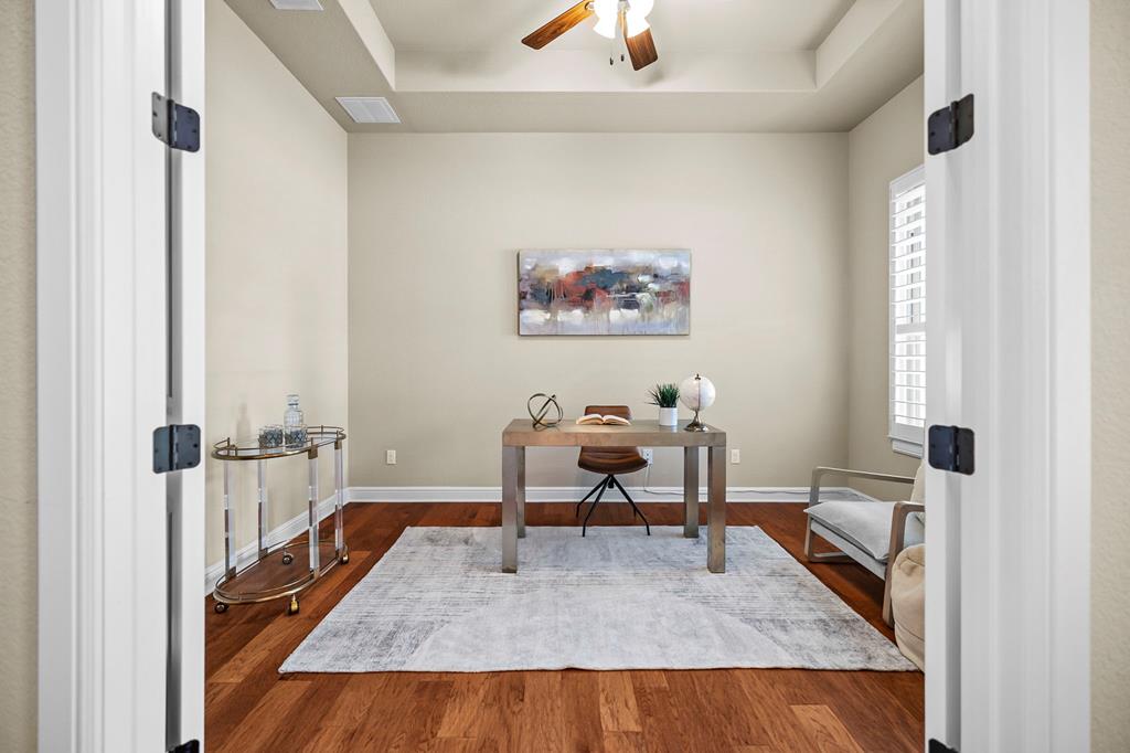 210 Mickelson Lane Georgetown, TX 78628 - Photo 6 of 39 a view of a workspace with furniture and a window