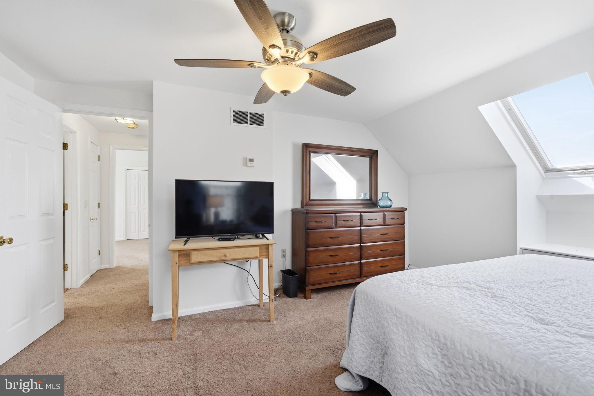 12089 Blacks Station Road Kennedyville, MD 21645 - Photo 24 of 39 a bedroom with a bed and a flat screen tv