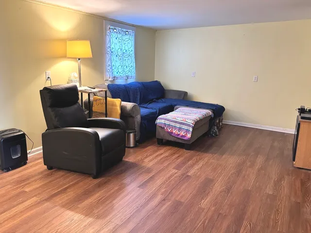 a bedroom with furniture and a window