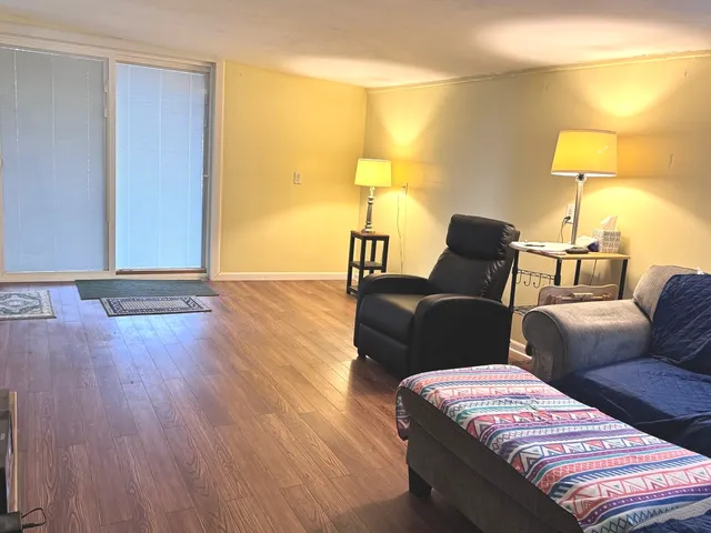 a bedroom with a bed and lamp