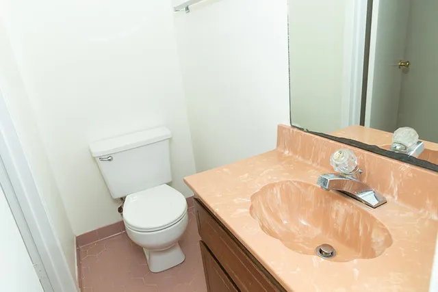 a bathroom with a sink and toilet