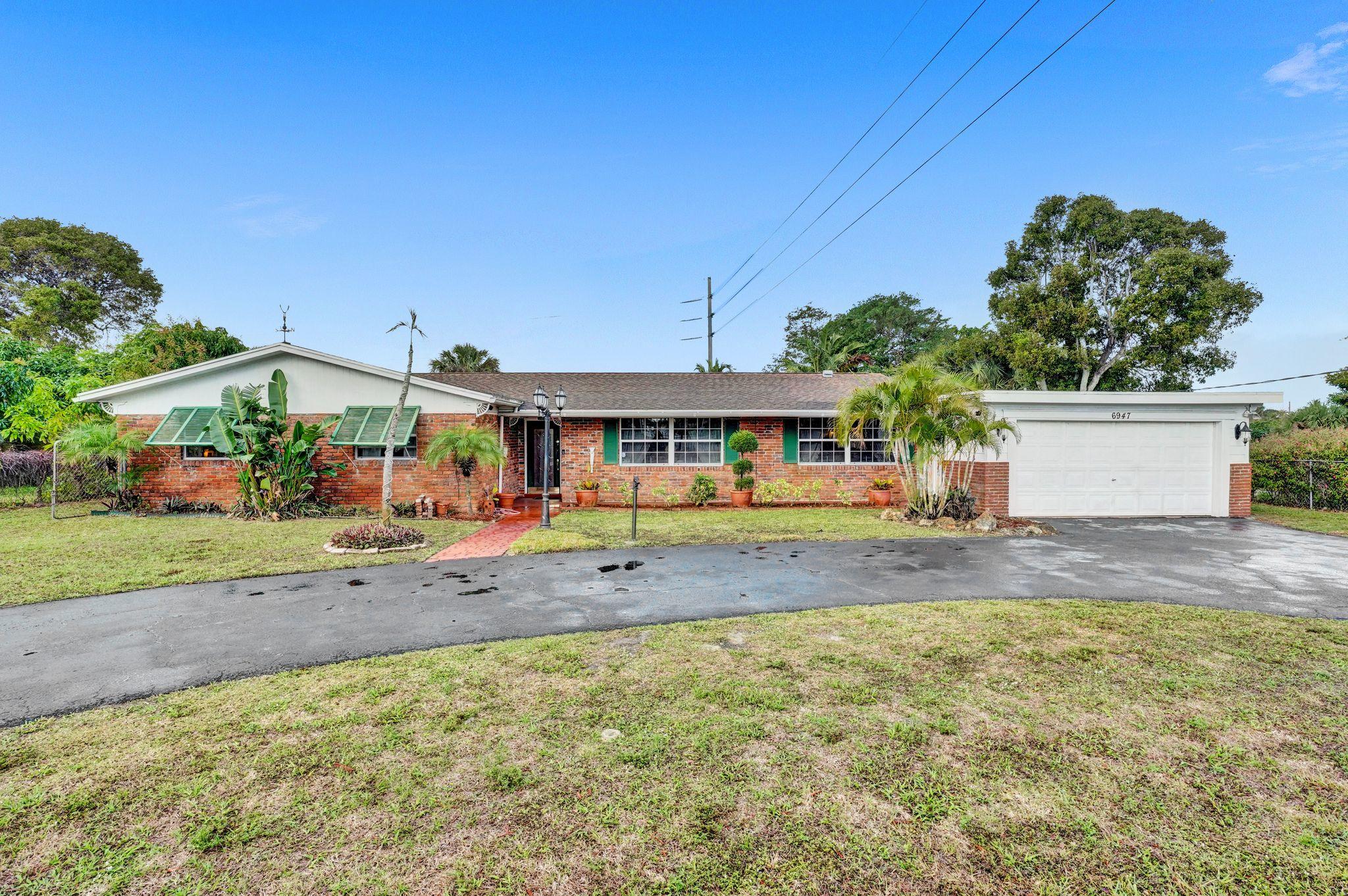 6947 High Ridge Road Lake Worth, FL 33462 - Photo 1 of 45 Welcome Home!