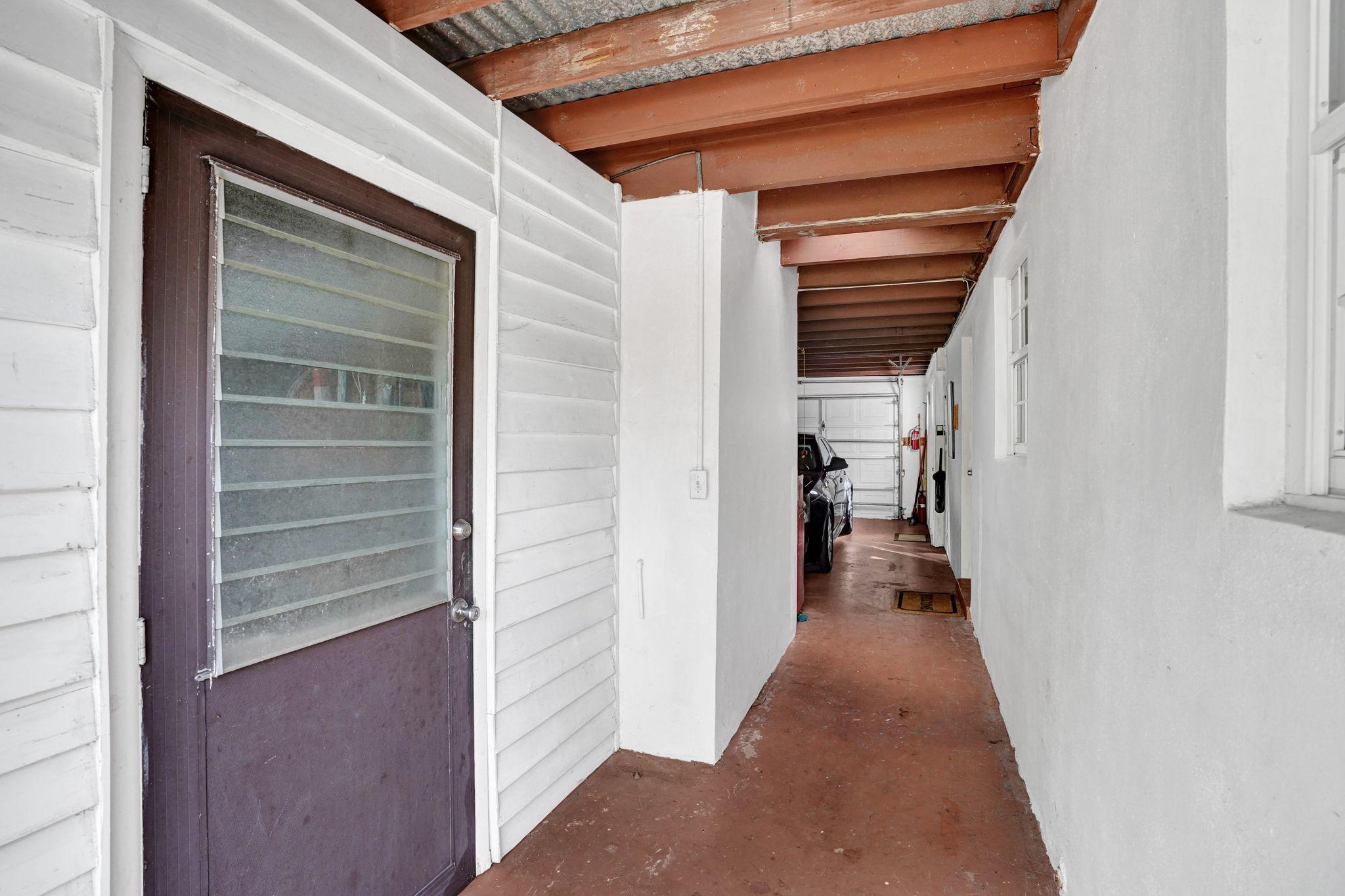 6947 High Ridge Road Lake Worth, FL 33462 - Photo 26 of 45 Breezeway!