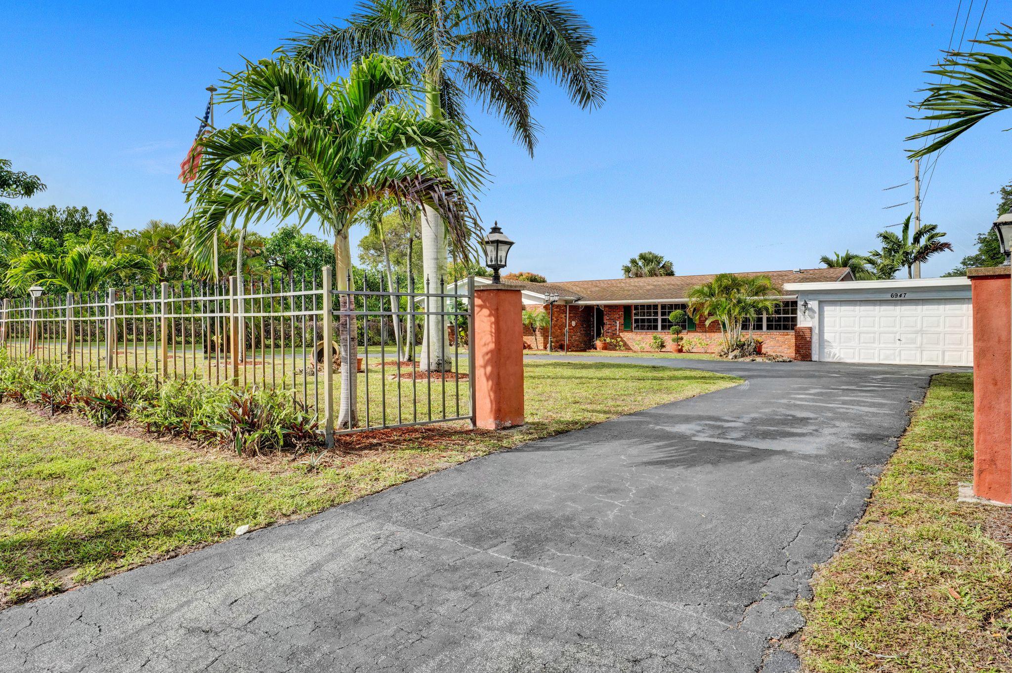 6947 High Ridge Road Lake Worth, FL 33462 - Photo 40 of 45 Fenced Yard/ Huge Driveway!