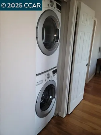 a view of a hallway with washer and dryer