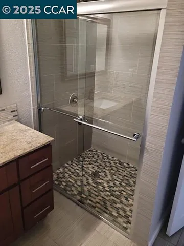 a bathroom with a sink and a shower