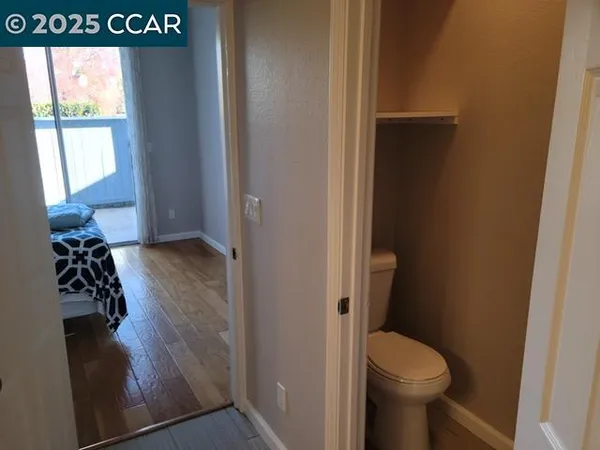 a view of a bathroom with a toilet