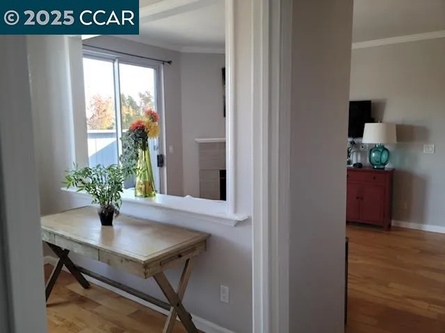 a workspace room with furniture and wooden floor