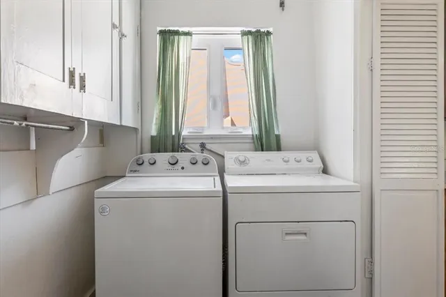 a living room with furniture and a book shelf