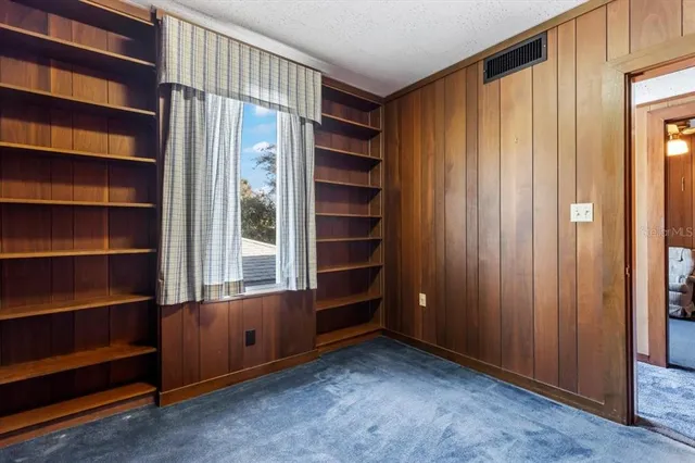 a bathroom with a sink a toilet a mirror and bathtub