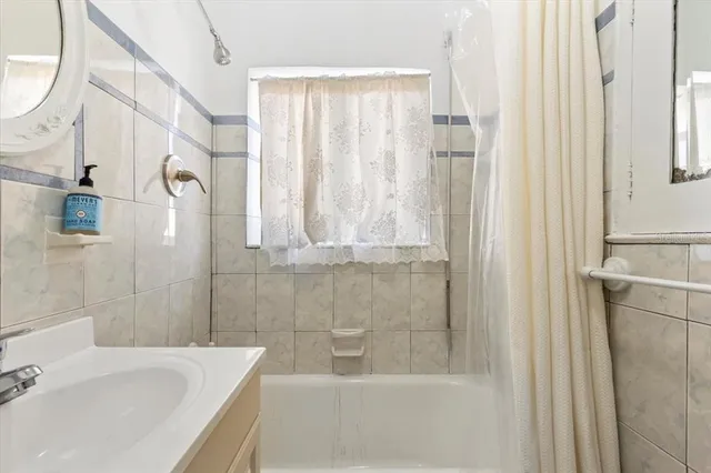 a bathroom with a toilet a sink and a shower