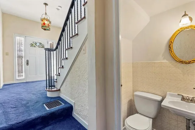 a kitchen with stainless steel appliances granite countertop a refrigerator stove and sink