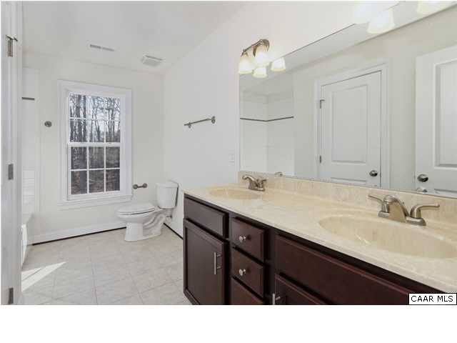 2416 Huntington Road Charlottesville, VA 22901 - Photo 20 of 24 a bathroom with a sink vanity and a mirror