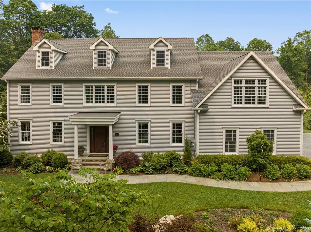 557 Tanner Marsh Road Guilford, CT 06437 - Photo 1 of 1 a front view of a house with a yard