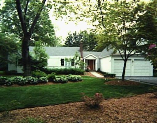 403 Roxbury Road Stamford, CT 06902 - Photo 1 of 1 a front view of a house with a yard and trees