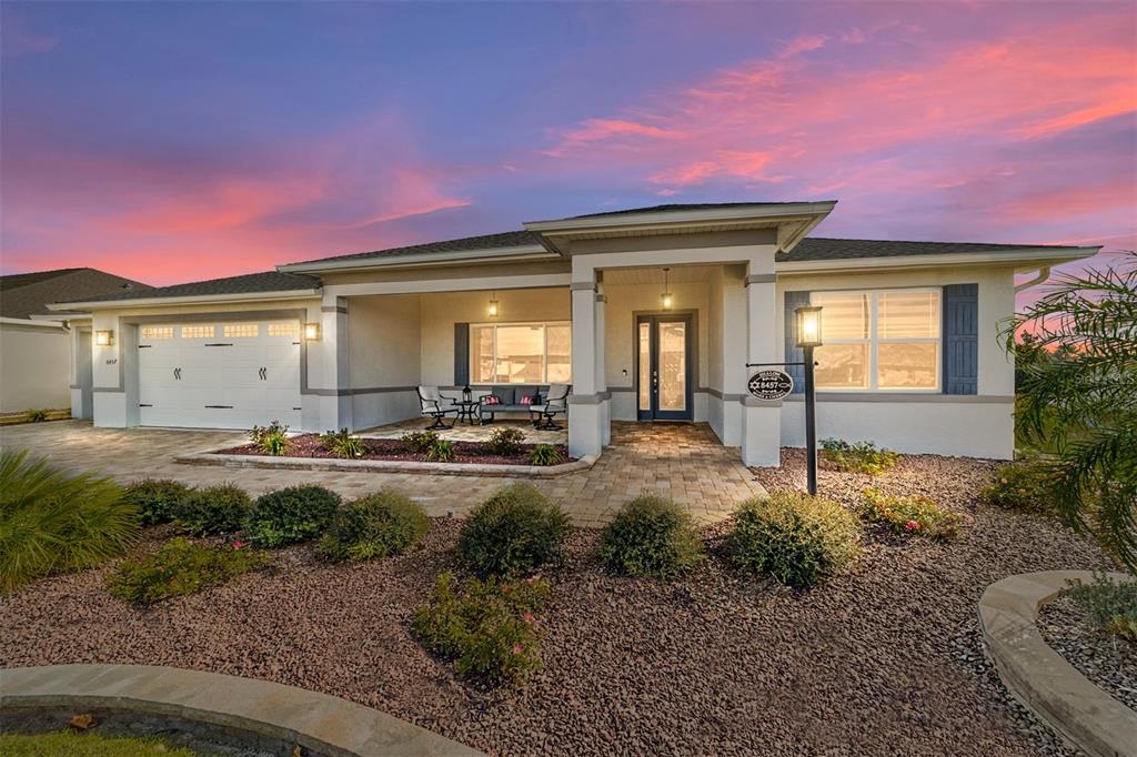 8457 Southwest 97th Circle Ocala, FL 34481 - Photo 1 of 62 a view of a house with backyard and sitting area