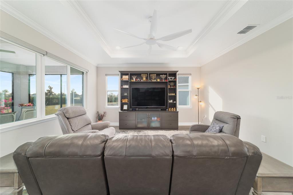 8457 Southwest 97th Circle Ocala, FL 34481 - Photo 13 of 62 a living room with furniture and a fireplace