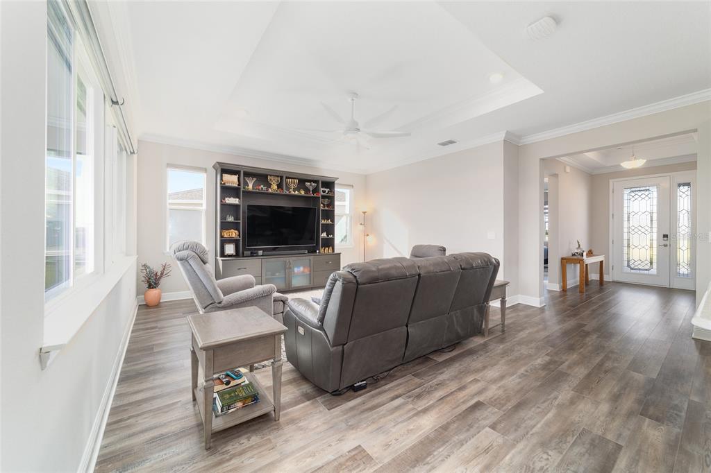 8457 Southwest 97th Circle Ocala, FL 34481 - Photo 14 of 62 a living room with furniture and a flat screen tv