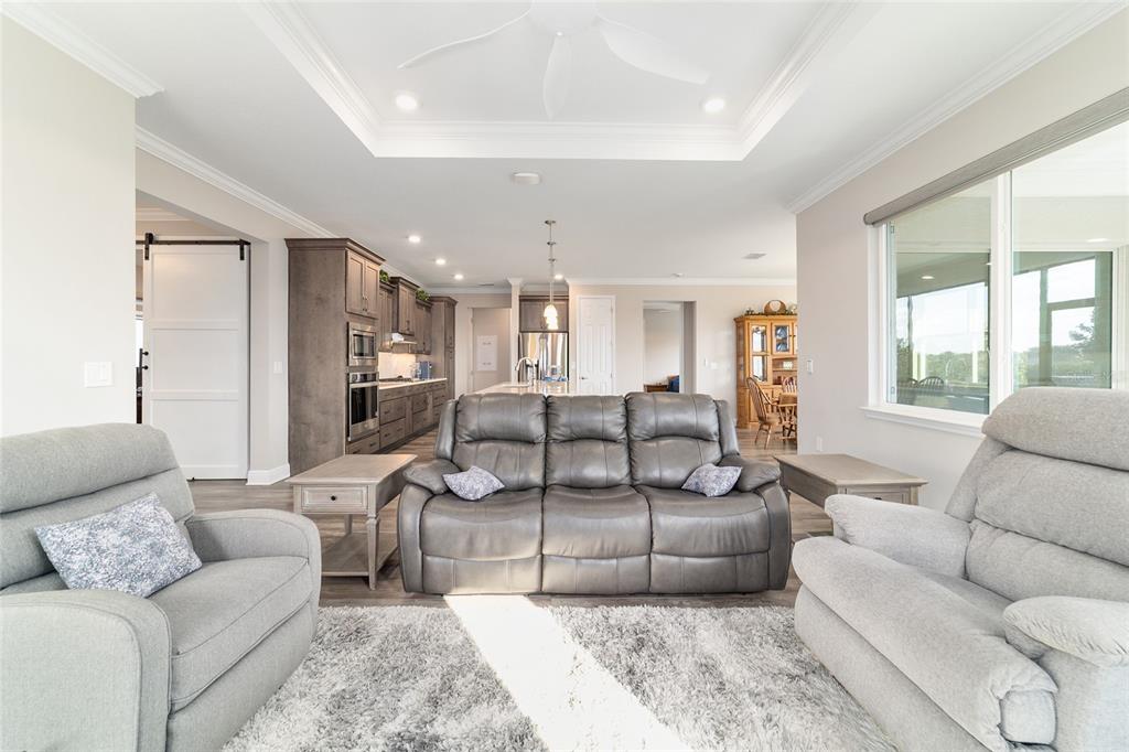 8457 Southwest 97th Circle Ocala, FL 34481 - Photo 16 of 62 a living room with furniture and a large window