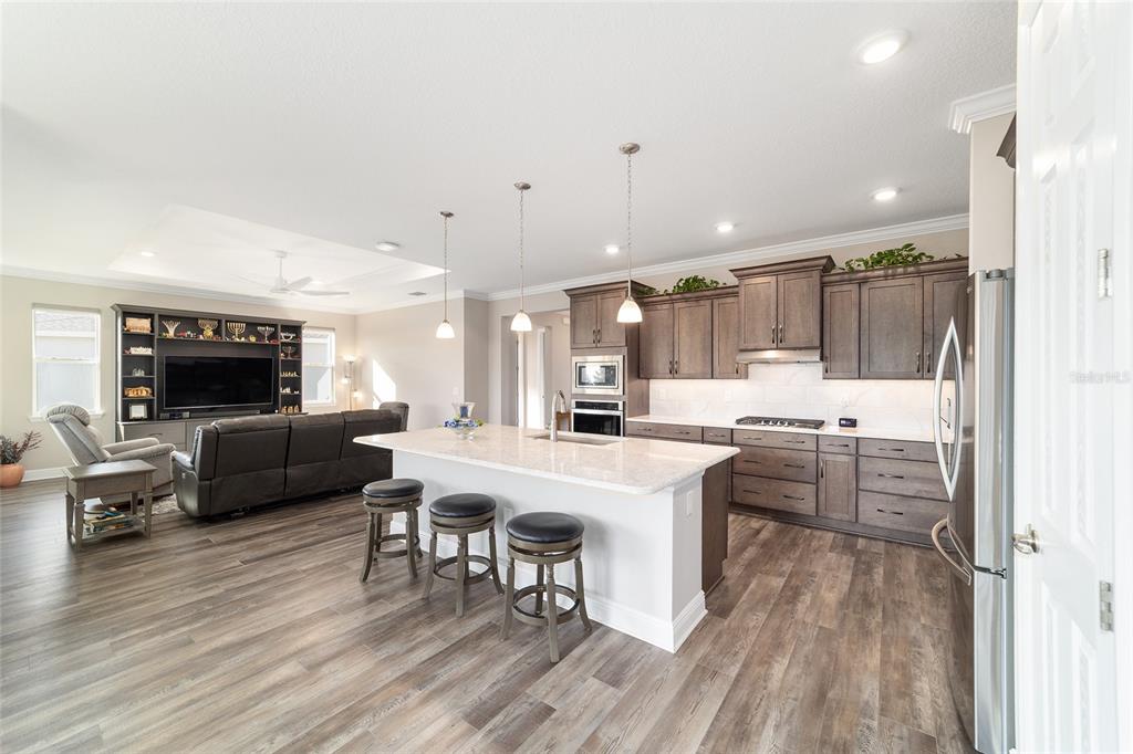 8457 Southwest 97th Circle Ocala, FL 34481 - Photo 23 of 62 a large white kitchen with a table and chairs