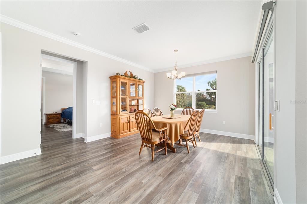 8457 Southwest 97th Circle Ocala, FL 34481 - Photo 30 of 62 a view of a dining room with furniture window and wooden floor