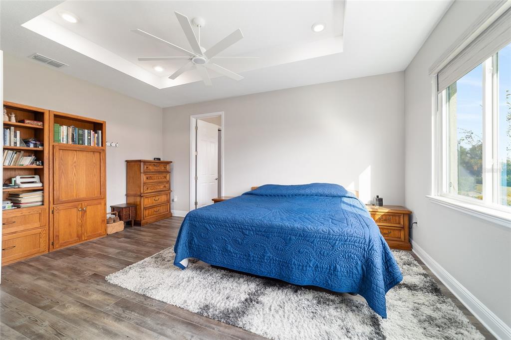 8457 Southwest 97th Circle Ocala, FL 34481 - Photo 35 of 62 a bedroom with a bed and a refrigerator